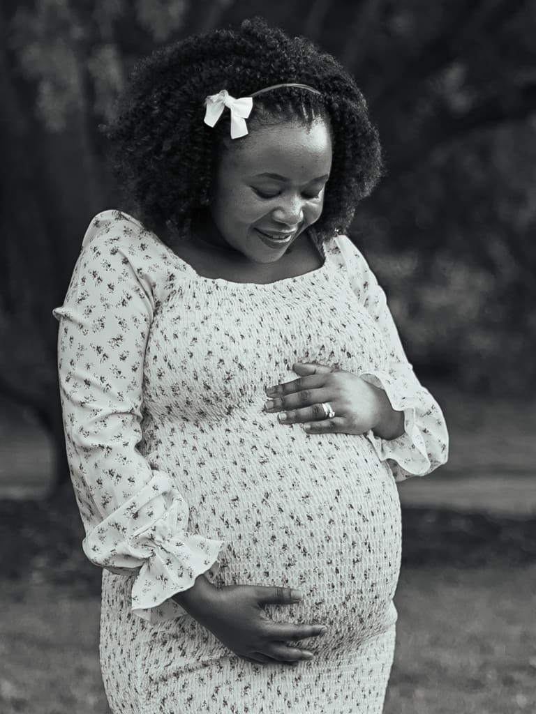 Pregnant mother preparing for prenatal appointments and considering red flags in prenatal care